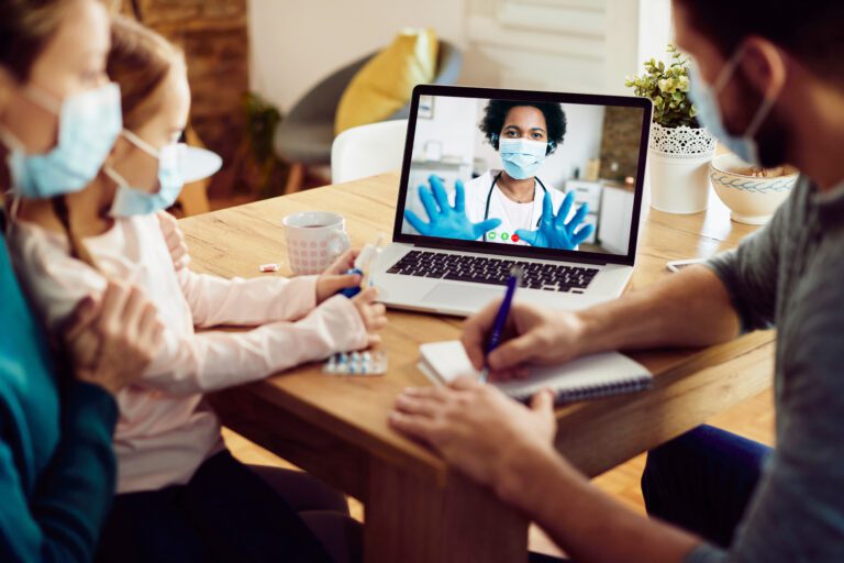 A family consults with a doctor via telemonitoring in the comfort of their home, showcasing the benefits of Texas Medicaid Telemonitoring.